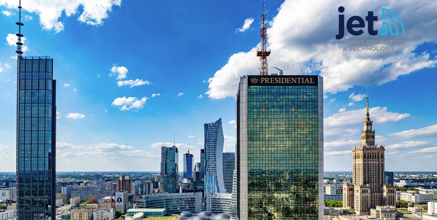 A modern city skyline featuring several tall glass skyscrapers including a prominent
